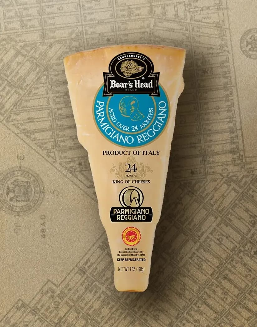 The Boar's Head® Parmigiano Reggiano Cheese sits on a tan illustrated image of New York City.